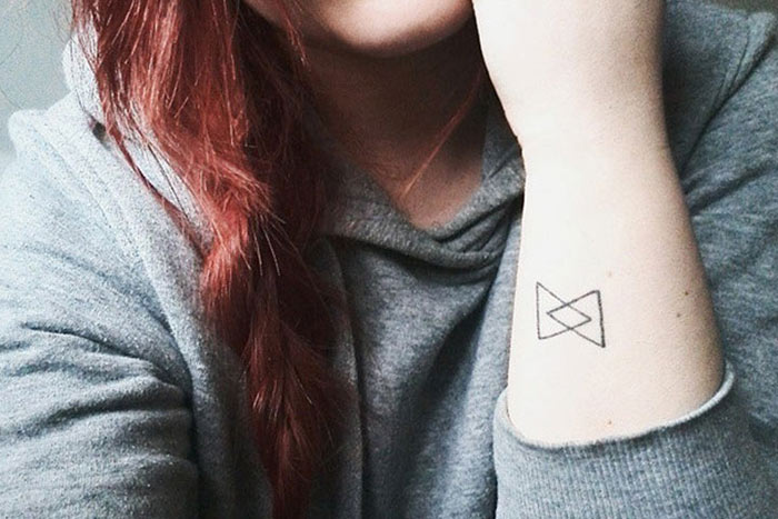 Connection tiny glyph tattoo