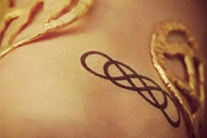 Double infinity tiny tattoo