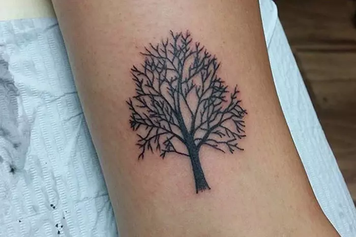 Fall inspired tiny tattoo of a tree without leaves