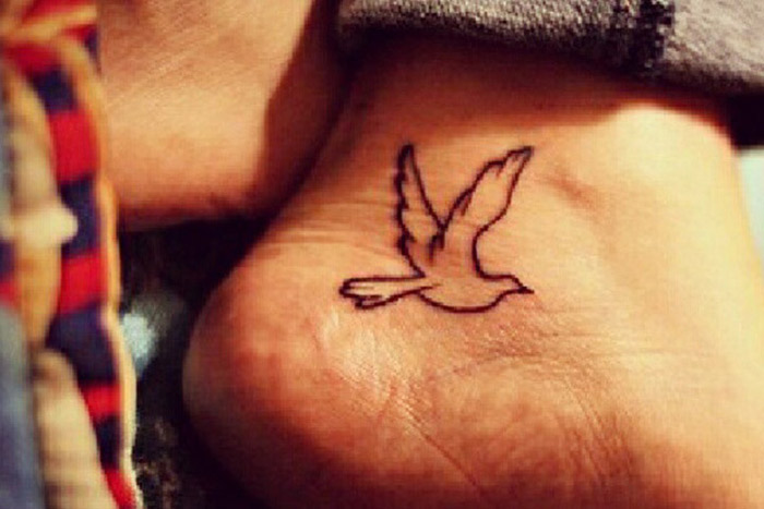 Flying dove tiny tattoo