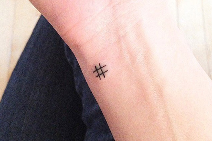 Tiny hashtag tattoo