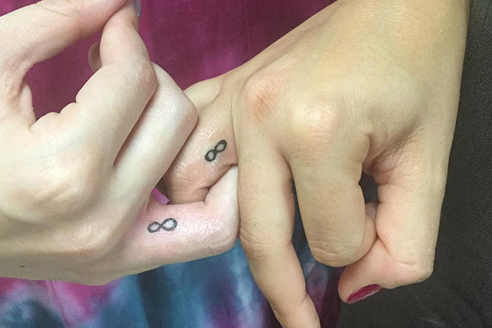 Matching infinity tiny tattoo