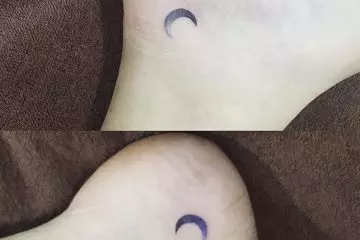 Crescent dark moon femininity symbol tiny tattoo