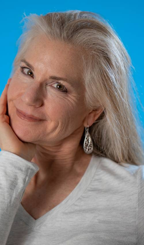 A woman with back brushed silver hair bob