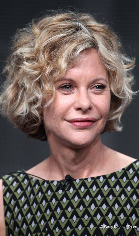 Curly bob with blond streak hairstyle for women over 50