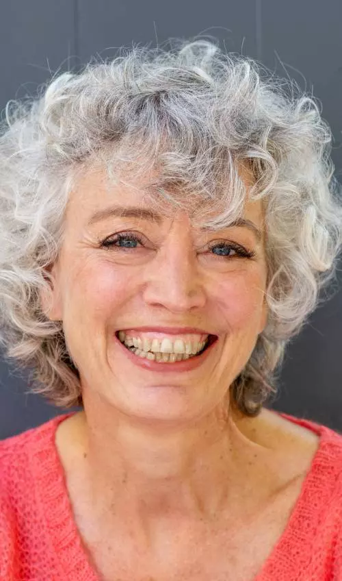 Pale blonde bob with wispy curls hairstyle for women over 50