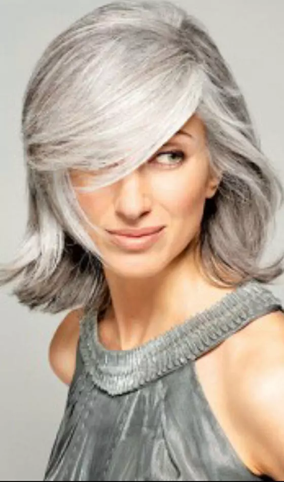 Platinum bob with side-swept bangs hairstyle for women over 50