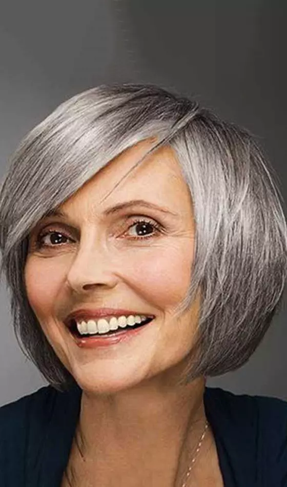 Platinum round bob with bangs hairstyle for women over 50