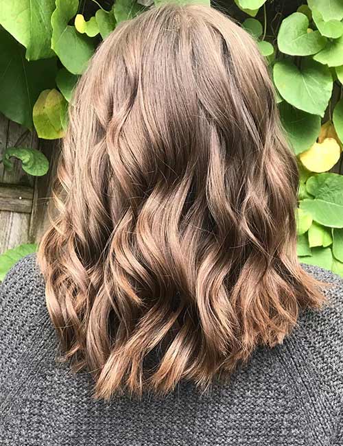 Golden brown layers hairstyle for thick hair