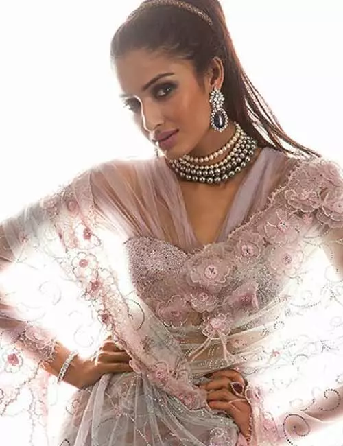 Corset style satin saree blouse design with satin motifs and net sleeves