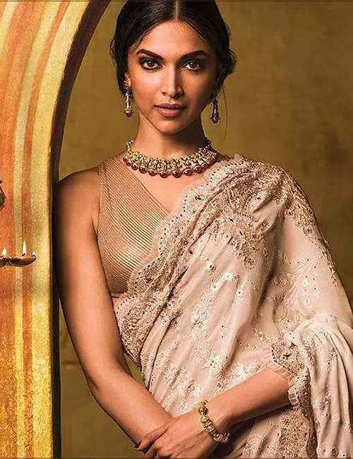 Golden sleeveless mesh saree blouse design for satin and silk sarees