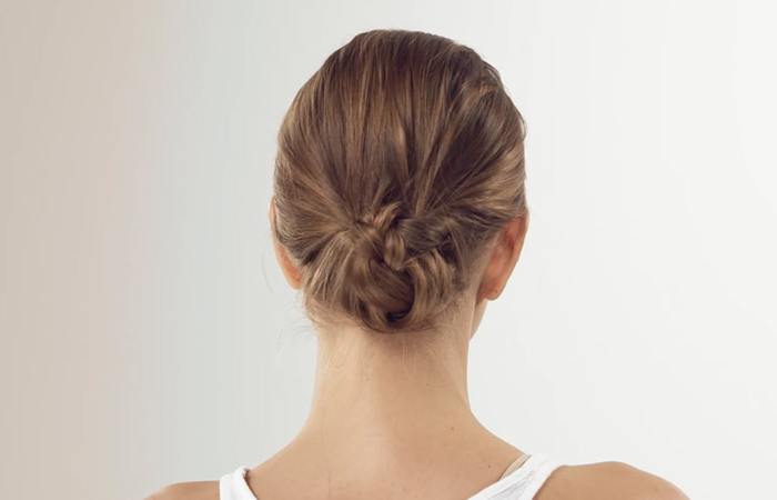 Step 10 of how to do a low bun