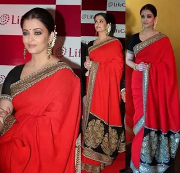 Aishwarya Rai in a blood red georgette saree with black kundan blouse
