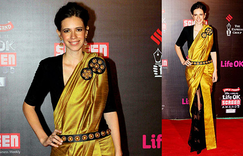Kalki Koechlin in a dull gold raw silk saree with a plain black blouse