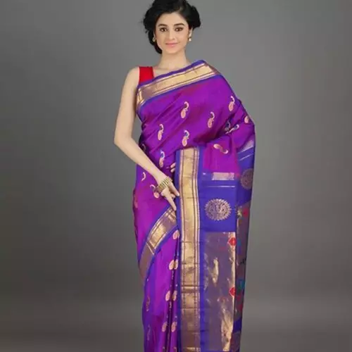 Purple paithani saree with gold bangdi booti and oblique border for wedding