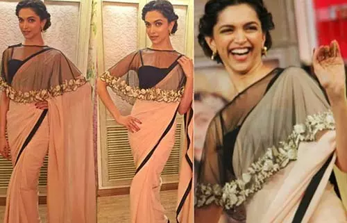 Deepika Paducone in a sheer cape blouse with plain georgette saree