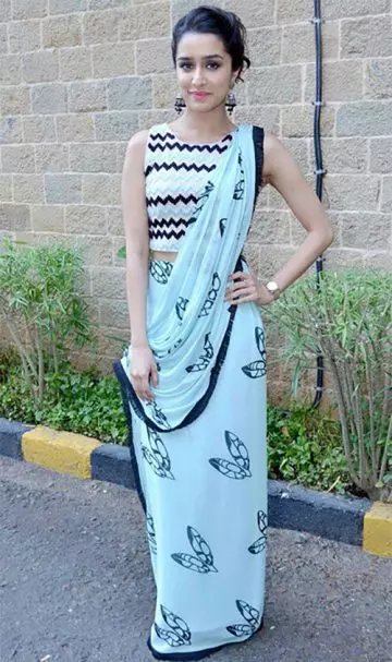 Shraddha Kapoor in a teal blue georgette saree with zig zag patterened blouse