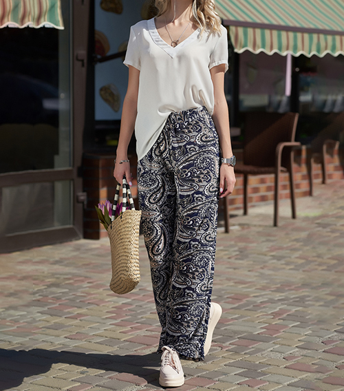 A girl in cropped folk palazzo trousers