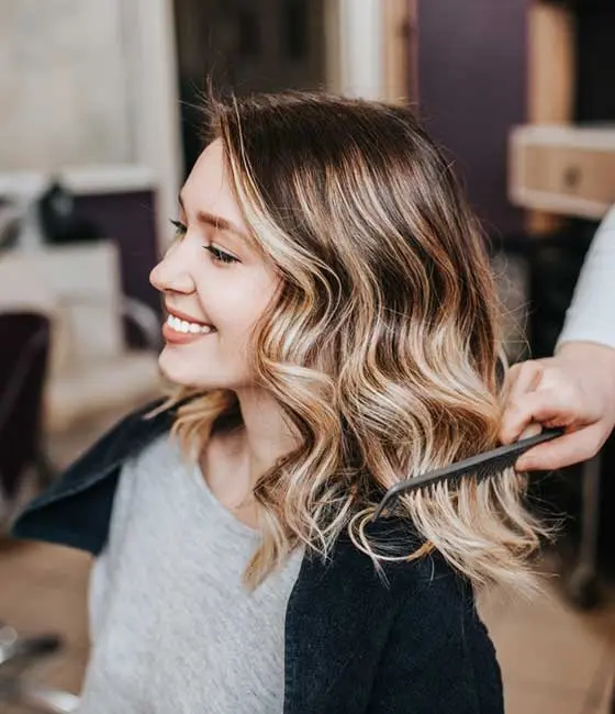 A woman in traditional balayage hair