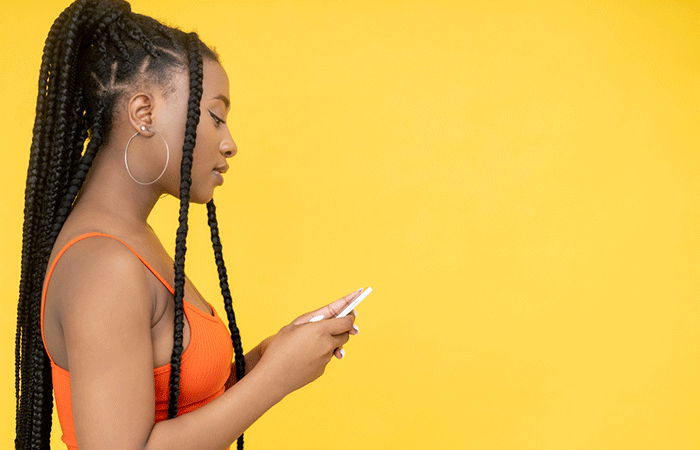 A young woman with triangle box braids