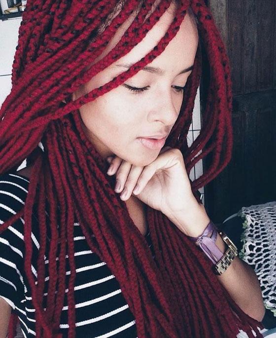 Ruby red box braids with bodacios look