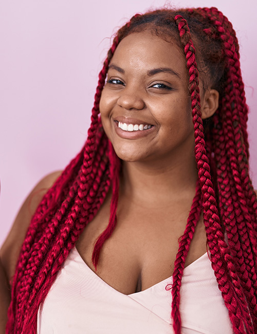 Ruby red box braids with bodacios look