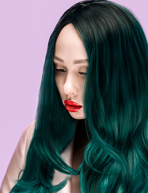 Teal green ombre on long wavy hair for a magical pixie look