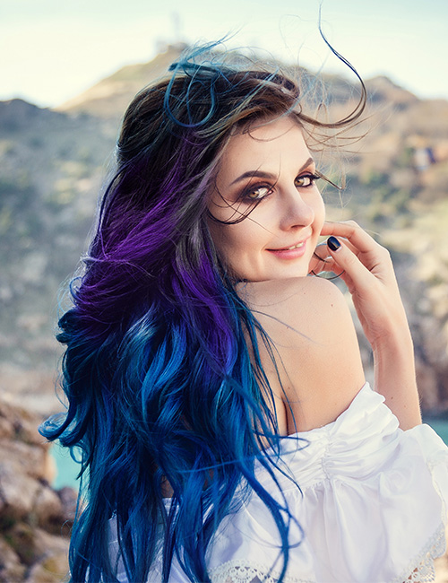 Ultraviolet ombre on long curly hair for a galaxy-inspired look