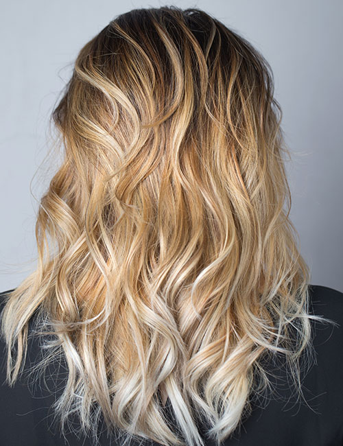 Warm or cool blonde ombre blunt cut ends for an edgy look