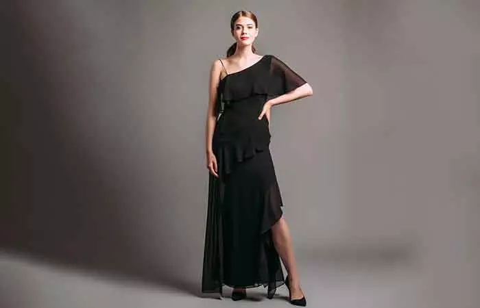 A lady in a black asymmetrical hem dress