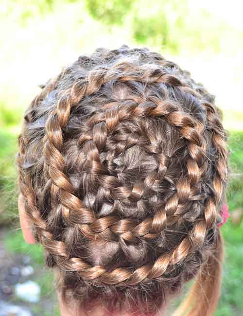Coiled spiral goddess braids hairstyle