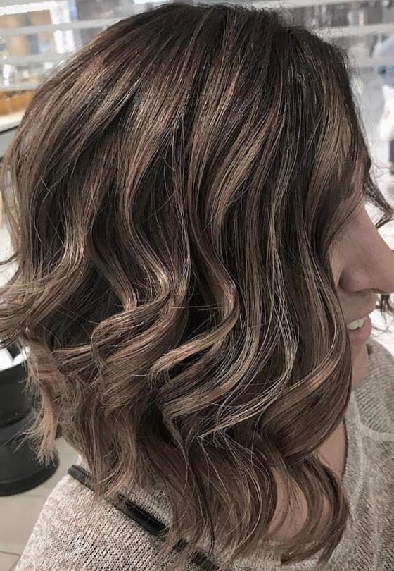 Short chocolate brown hair highlighted with ash blonde streaks