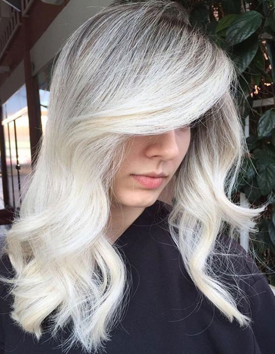 Dark to light ash blonde hair color creates a stunning contrast of hair colors