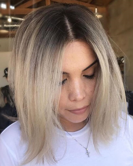 Iced latte ash blonde hair color looks like a perfectly made latte
