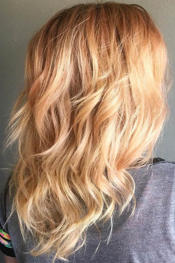 Light and bright strawberry blonde hair color