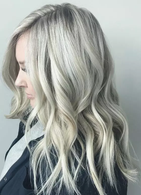 Platinum ash blonde look with has grayish ash blonde undertones for long hair