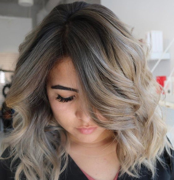 Smoky ash blonde hair colour looks stunning with loose big curls or waves