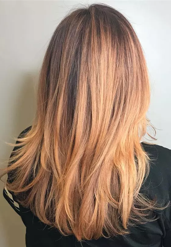Strawberry blonde root melt hair color