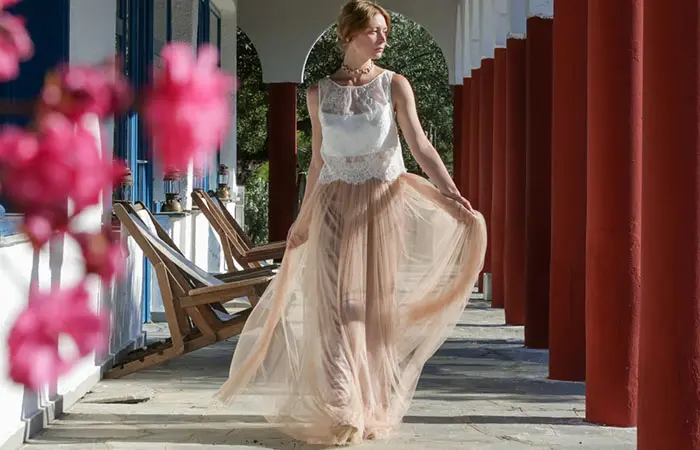 A woman dressed in a flowing maxi skirt