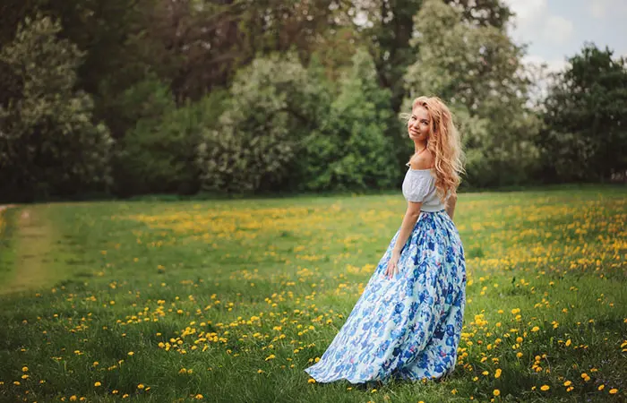 A woman dressed in a floral maxi skirt