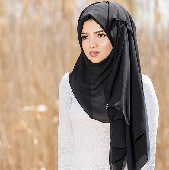 Muslim Young Woman Weared in Traditional Dress and Scarf Touches