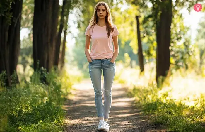 A happy woman in skinny crop jeans