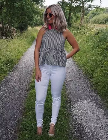 White jeans and gray top