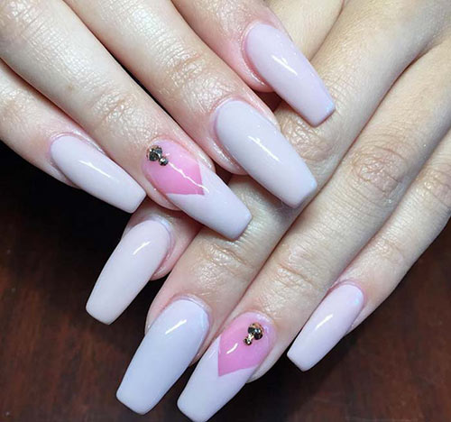 Dual tone pink acrylic nail design with jewel accents