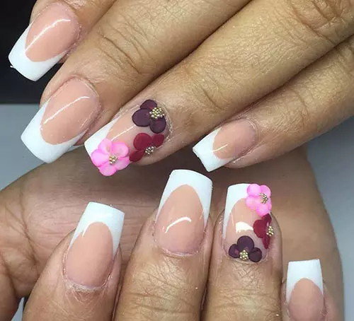 French tipped acrylic nail design with floral accents