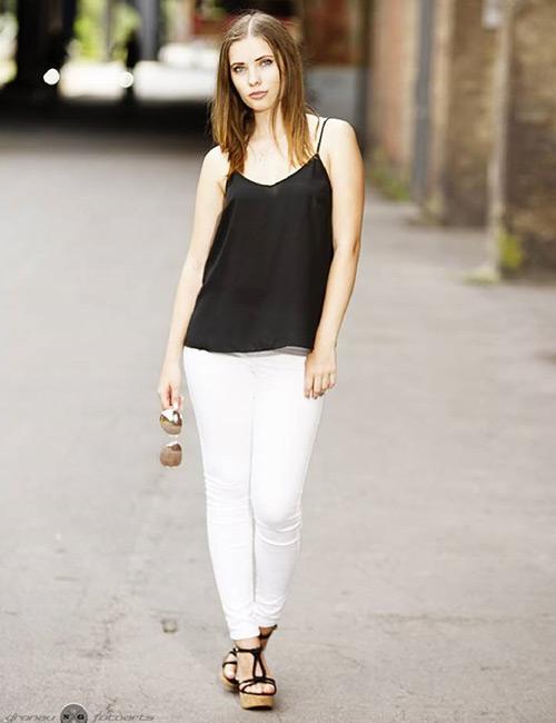 Black jeggings and crop top! High bun and metallic tattoos