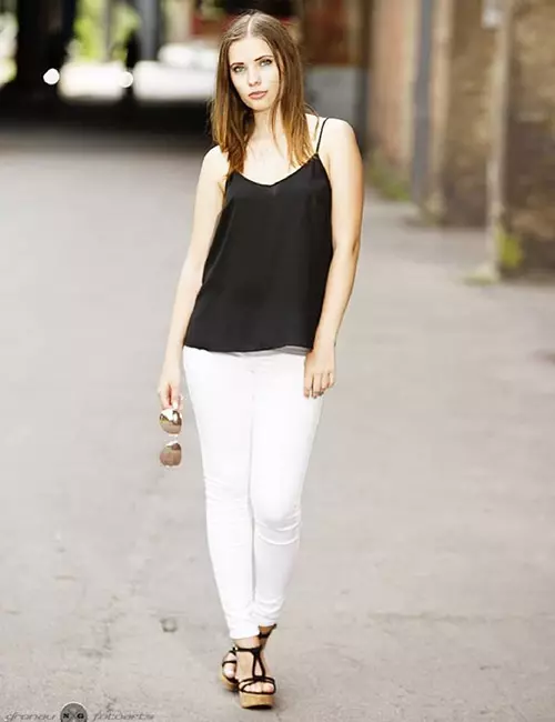 White jeans with black top and accessories