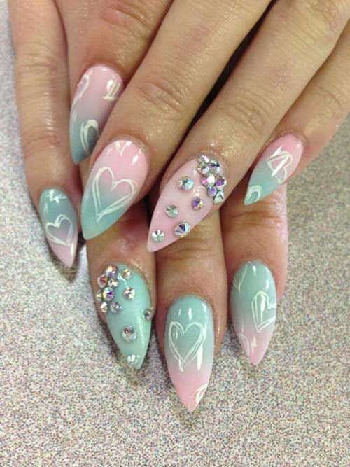 Pink and blue ombre acrylic nail design with hearts and jewel accents