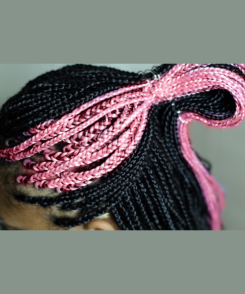 Pink micro braids half updo hairstyle