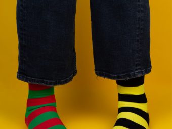 Woman wearing differently colored striped socks